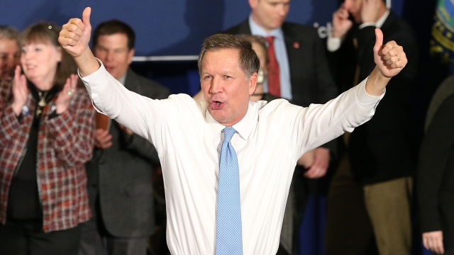 Republican presidential candidate Ohio Governor John Kasich waves to the crowd after speaking at a campaign gathering with su