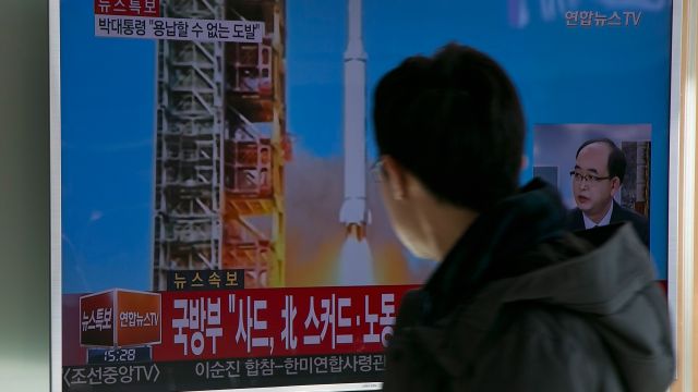 People watch a supposed missile launch from North Korea.
