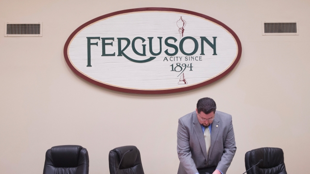 Mayor James Knowles packs up following a city council meeting in Ferguson, Missouri