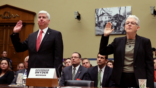 Rick Snyder and Gina McCarthy get sworn in during a congressional hearing.
