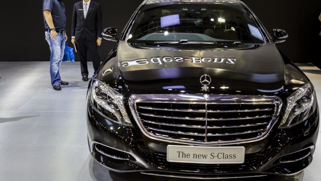 Visitors look at the new S-Class by Mercedes-Benz display at the 2014 Indonesia International Motor Show.