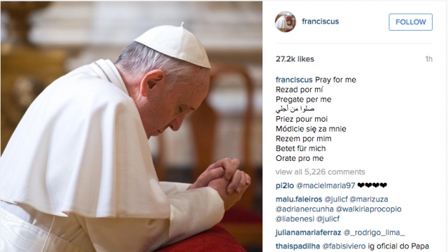 Pope Francis is pictured praying in an Instagram photo posted to his new account.