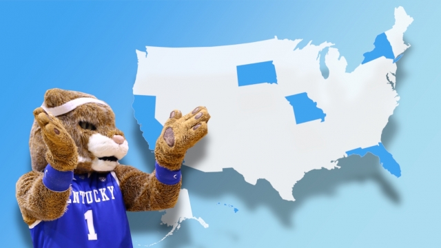 The Kentucky Wildcats' mascot is pictured in front of a map of the United States.