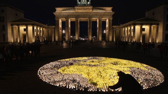 Volunteers light candles in the shape of the earth at an Earth Hour event in Berlin, Germany in 2012
