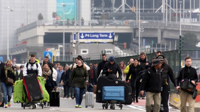 Passengers are evacuated from Zaventem Bruxelles International Airport after a terrorist attack on March 22, 2016 in Brussels