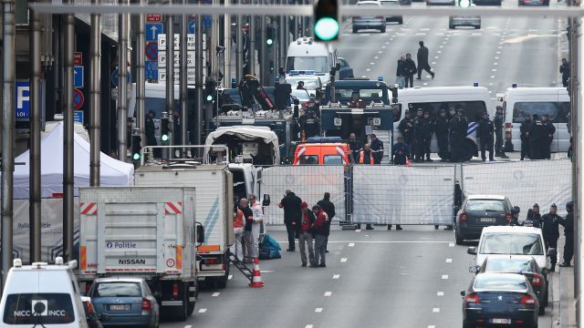Police gather outside a Brussels metro station after a terrorist attack.