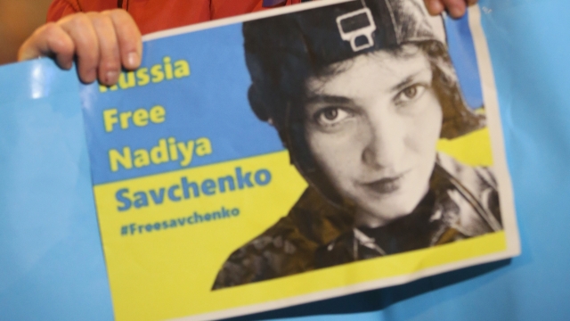A woman holds up a sign demanding the release of Ukrainian army pilot Nadezhda Savchenko.