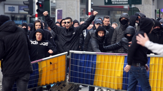 Self-described fascist protestors disrupt a gathering of mourners in Brussels.