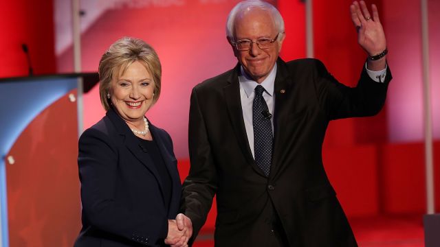 Democratic presidential candidates Hillary Clinton and Bernie Sanders shake hands.