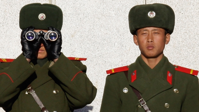 North Korean soldiers look at South Korea across the Korean Demilitarized Zone.