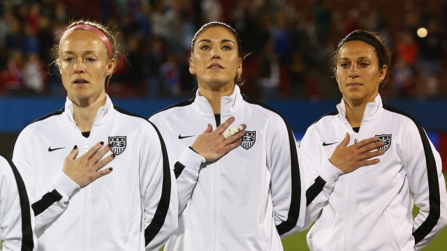 Becky Sauerbrunn #4, Hope Solo #1 and Carli Lloyd #10 of USA before a match against Costa Rica.