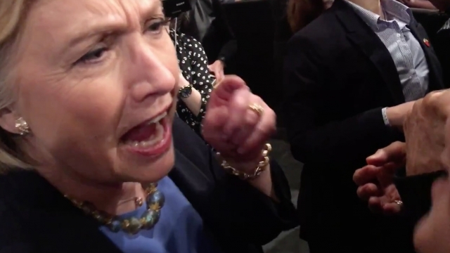 Hillary Clinton confronts an environmental activist at a campaign rally.