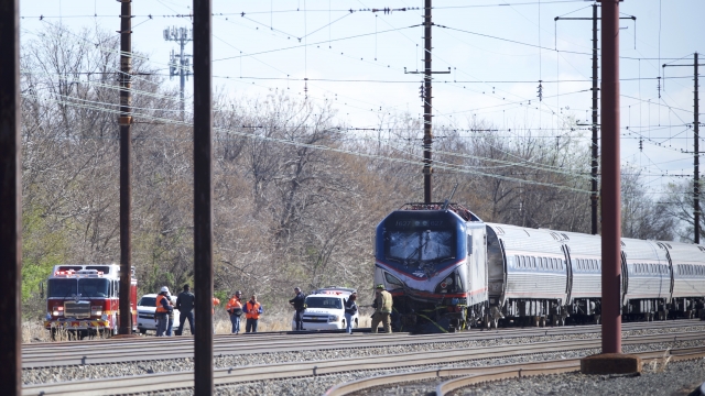 Emergency personnel investigate the crash site of Amtrak Palmetto train 89 on April 3, 2016 in Chester, Pennsylvania.
