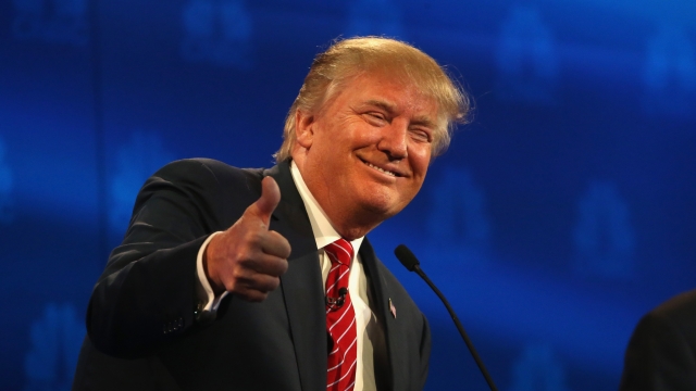 Presidential candidate Donald Trump gives a thumbs up during the CNBC Republican Presidential Debate.