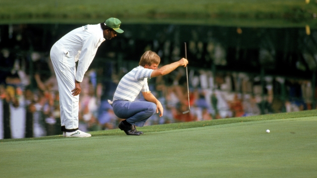 Ben Crenshaw lines up a putt during the 1984 Masters tournament in Augusta National Golf Club in Augusta, Georgia.