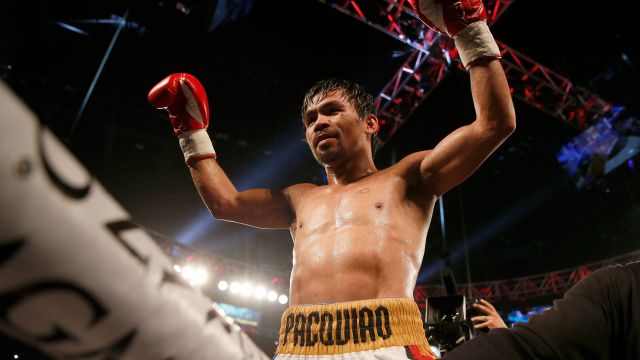 Manny Pacquiao celebrates after defeating Timothy Bradley Jr. by unanimous decision.