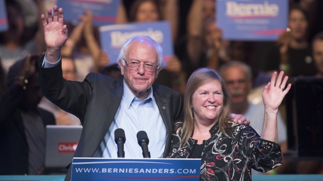 Democratic presidential candidate U.S. Sen. Bernie Sanders and his wife, Dr. Jane O'Meara Sanders, wave to supporters.