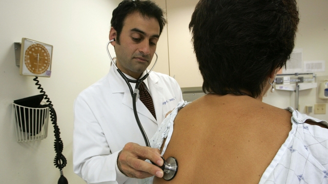 A doctor examines a patient at the UCSF Women's Health Center in San Francisco.