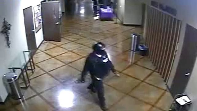 A man in SWAT gear is seen in this image from a surveillance camera.