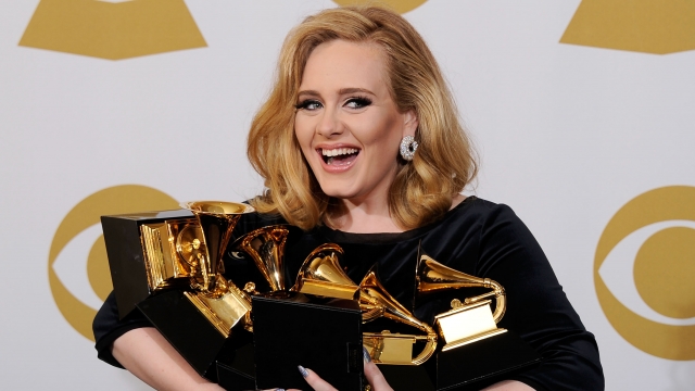 Adele poses with her Grammy awards in 2012.