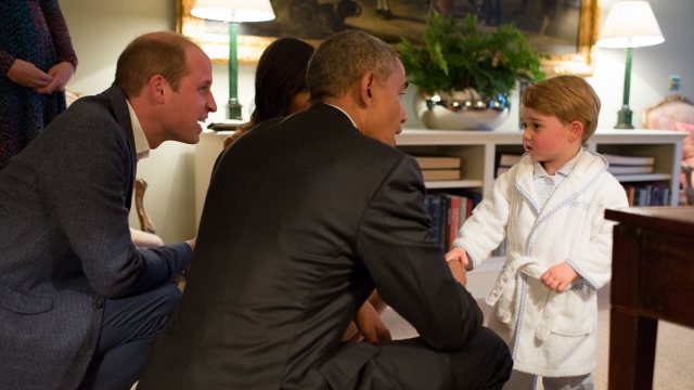 President Barack Obama, Prince William and first lady Michelle Obama talks with Prince George at Kensington Palace.