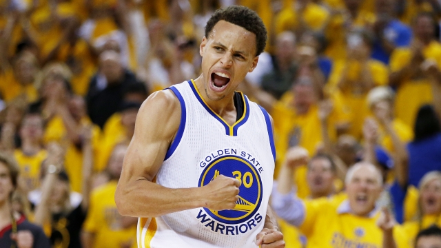 Stephen Curry of the Golden State Warriors celebrates against the Cleveland Cavaliers