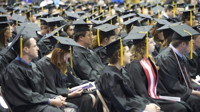 High school graduates attend their commencement ceremony.