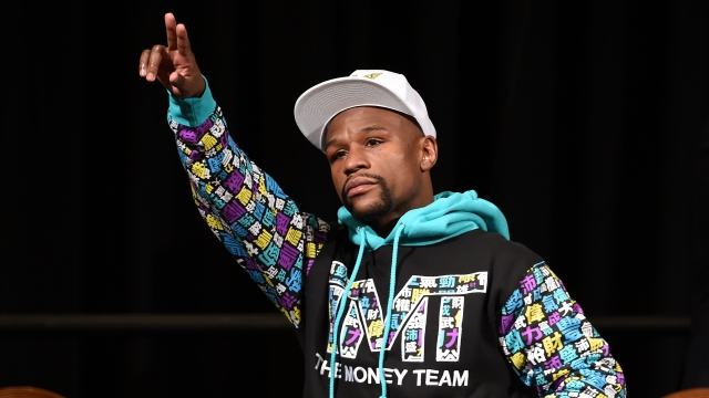 Floyd Mayweather Jr. walks in to his post-fight news conference at MGM Grand Hotel & Casino.
