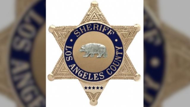 A badge from the Los Angeles County Sheriff's Department, where a high-ranking official resigned over the emails.