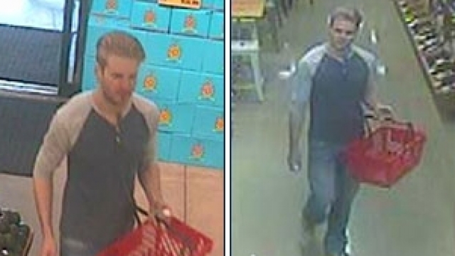 The FBI wants to find the man pictured here, who appeared to sprinkle a liquid on carts at a Michigan Whole Foods store.