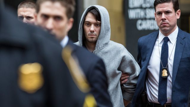 Martin Shkreli, CEO of Turing Pharmaceutical, is brought out of 26 Federal Plaza by law enforcement officials.