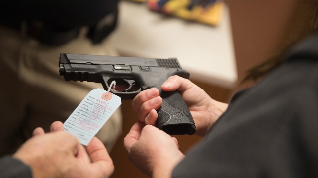Customers shop for a handgun at Metro Shooting Supplies in Bridgeton, Missouri.
