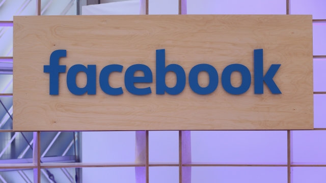 The Facebook logo is displayed at the Facebook Innovation Hub technology exhibit.