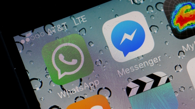 In this photo illustration, the WhatsApp application is displayed on an iPhone.