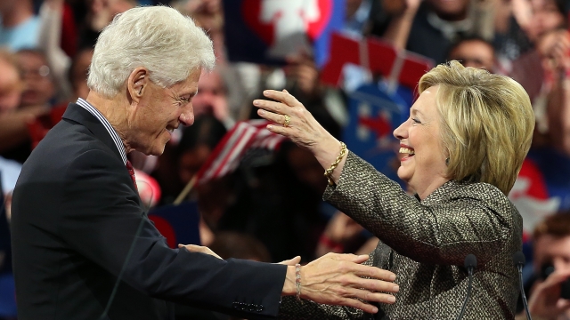 Democratic presidential candidate Hillary Clinton embraces her husband, former President Bill Clinton.
