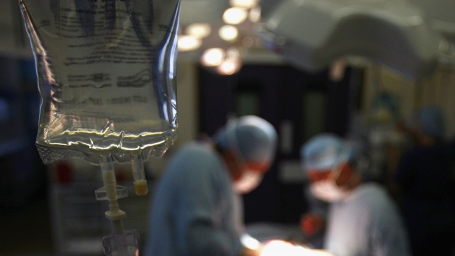 Surgeons at The Queen Elizabeth Hospital Birmingham conduct an operation on June 14, 2006, Birmingham, England.