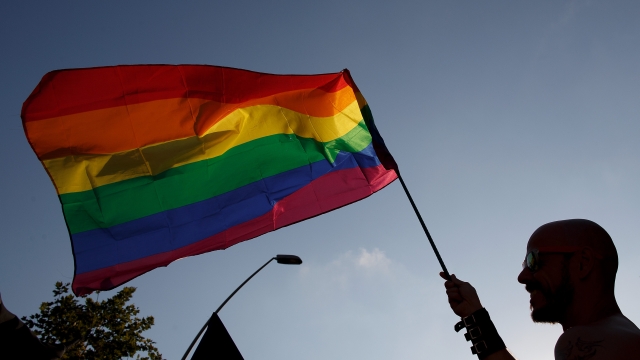 A man waves a pride flag during the annual Pride Parade in Barcelona, Spain.