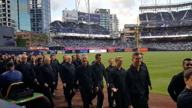 The San Diego Gay Men's Chorus walking off the field after the national anthem incident.