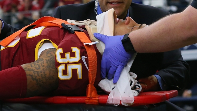 Dashaun Phillips No. 35 of the Washington Redskins is taken off the field in a stretcher after an injury.