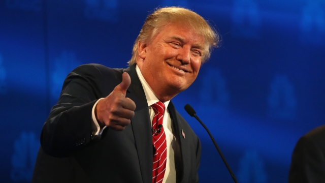 Presidential candidate Donald Trump gives a thumbs-up during the CNBC Republican Presidential Debate.