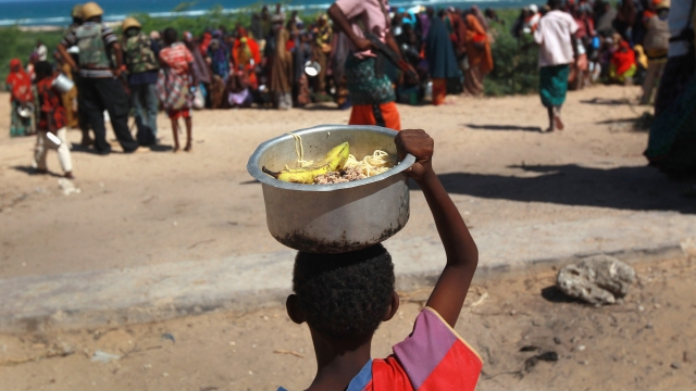 Refugees get food rations in Somalia.