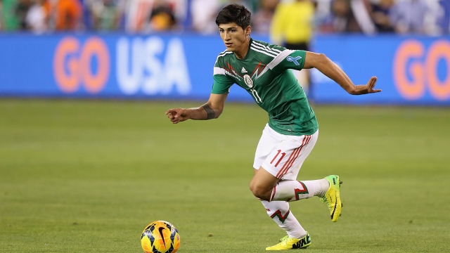 Alan Pulido of Mexico handles the ball during an international friendly against USA