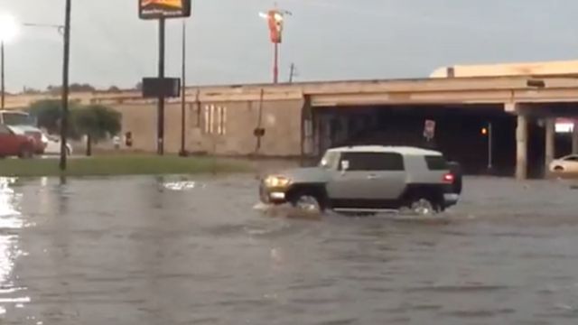 A car tries to get through a flood in Texas.