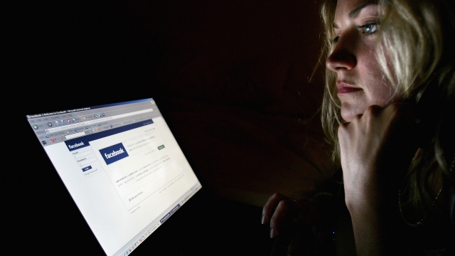 In this photo illustration a girl browses the social networking site Facebook on July 10, 2007 in London, England.