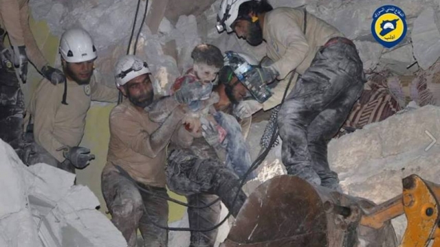 A child pulled alive from the rubble of an airstrike in Syria.