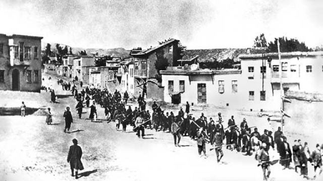 Armenians are marched to a nearby prison in Mezireh by Ottoman soldiers. Kharpert, Armenia, Ottoman Empire, April, 1915