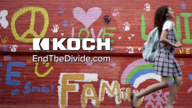 A young girl wearing a backpack walks in front of a wall in Koch Industries' new "End the Divide" commercial.