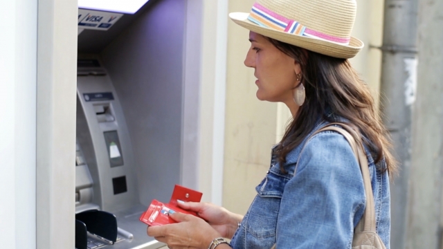 Woman at ATM.