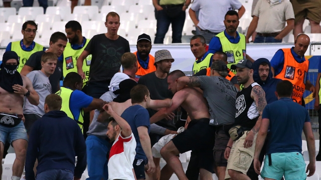 Soccer fans fight in the stands after the Russia vs. England match.