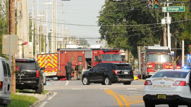 Emergency personnel surround the scene of the shooting.